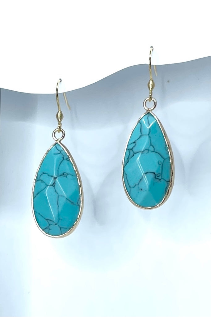 These earrings in Turquoise simulant are bezel set in gold tone, a perfect summer boho style.