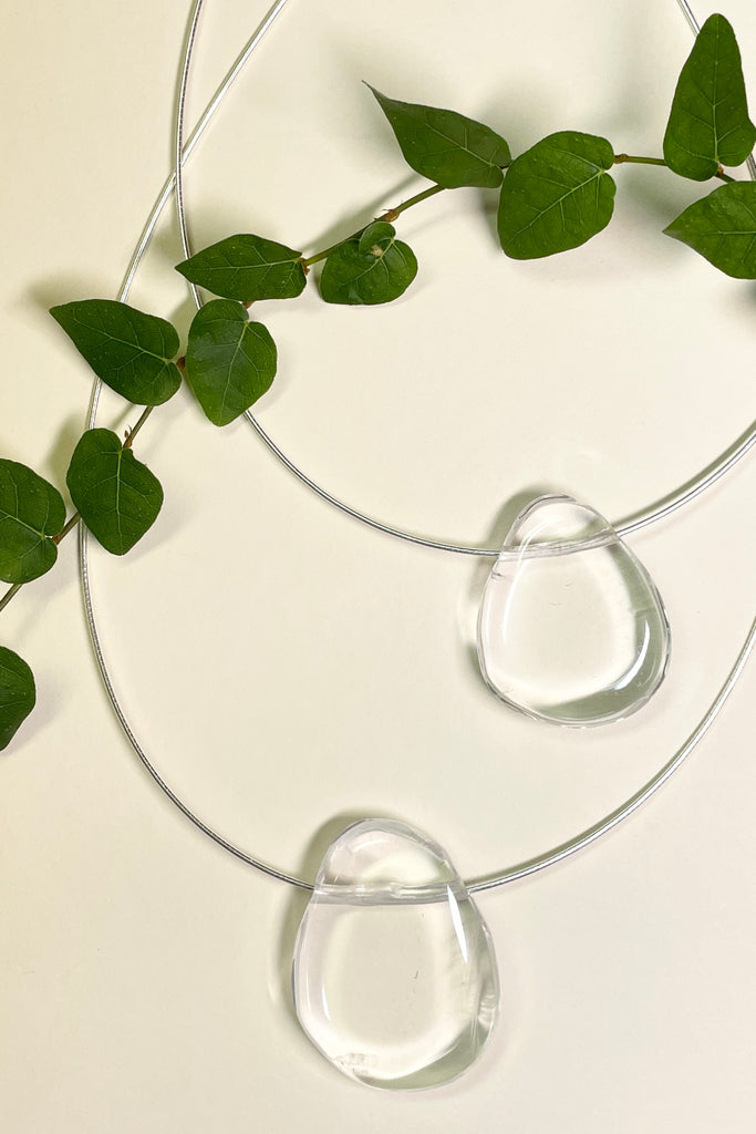 The Pendant is a gorgeous clear rock crystal, it hangs from a 925 silver Omega chain.