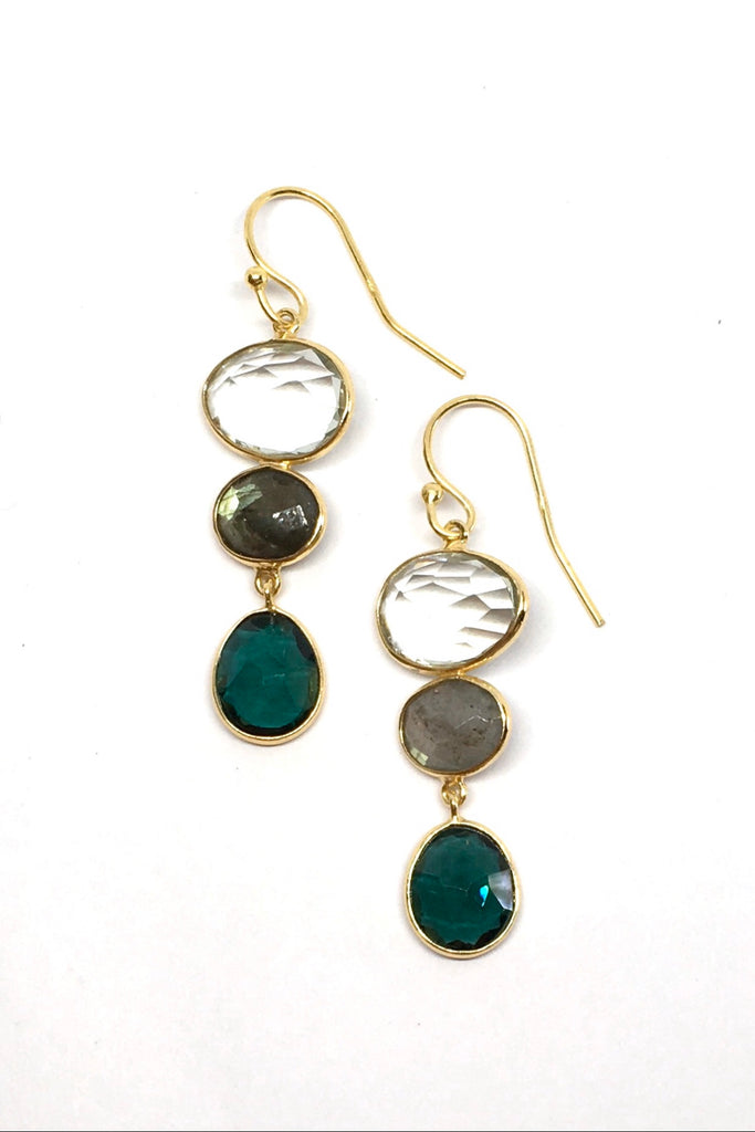 A modern bohemian inspired design of smokey toned crystal stones incased in gold vermeil