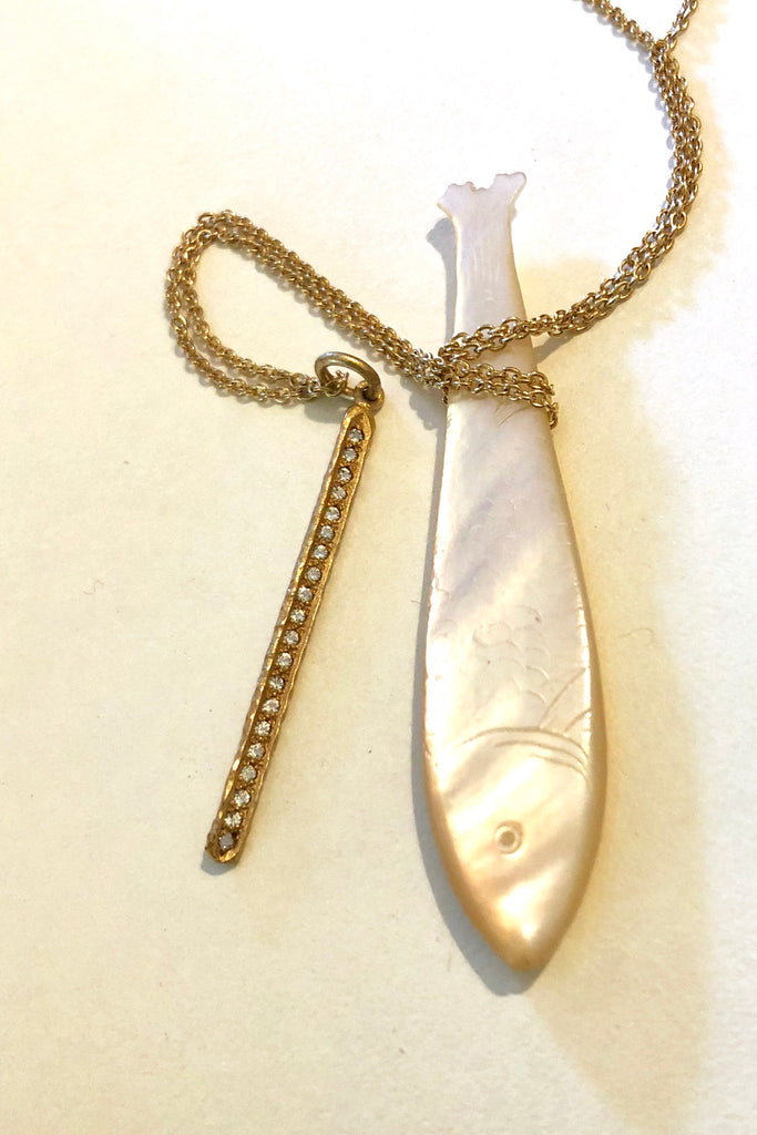 Made in gold vermeil and tiny sparkling white topaz gemstones, the finish is quiet and naturalistic, the surface is matte. 