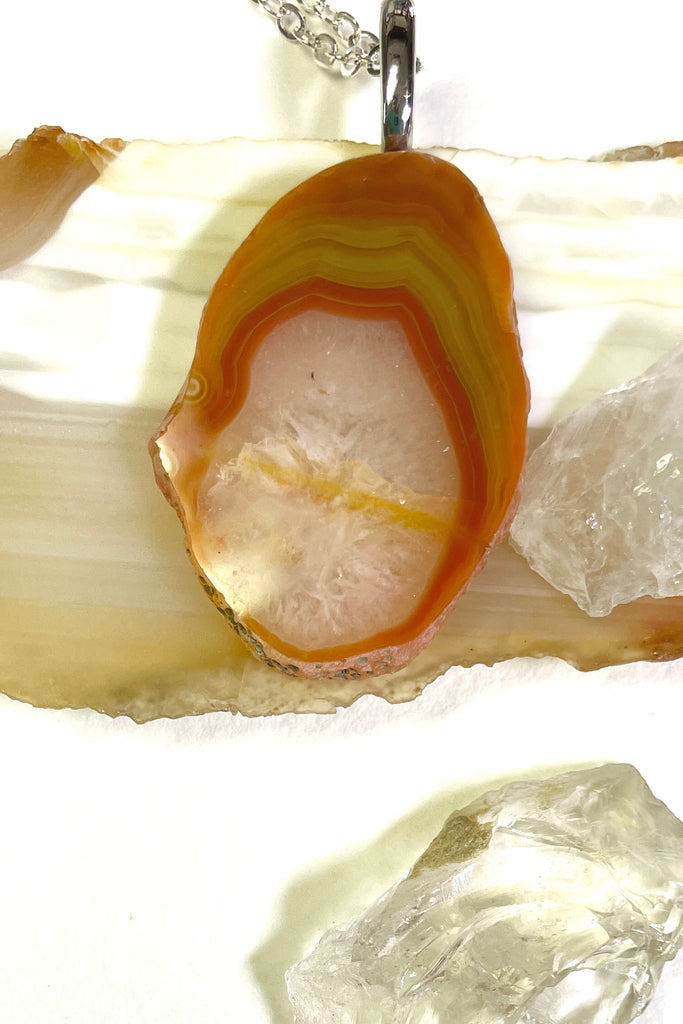  Australian stone pendant has been cut by an Australian fossicker, it is from Agate Creek. A fairly large piece, it has an oval window of crystalline quartz, 