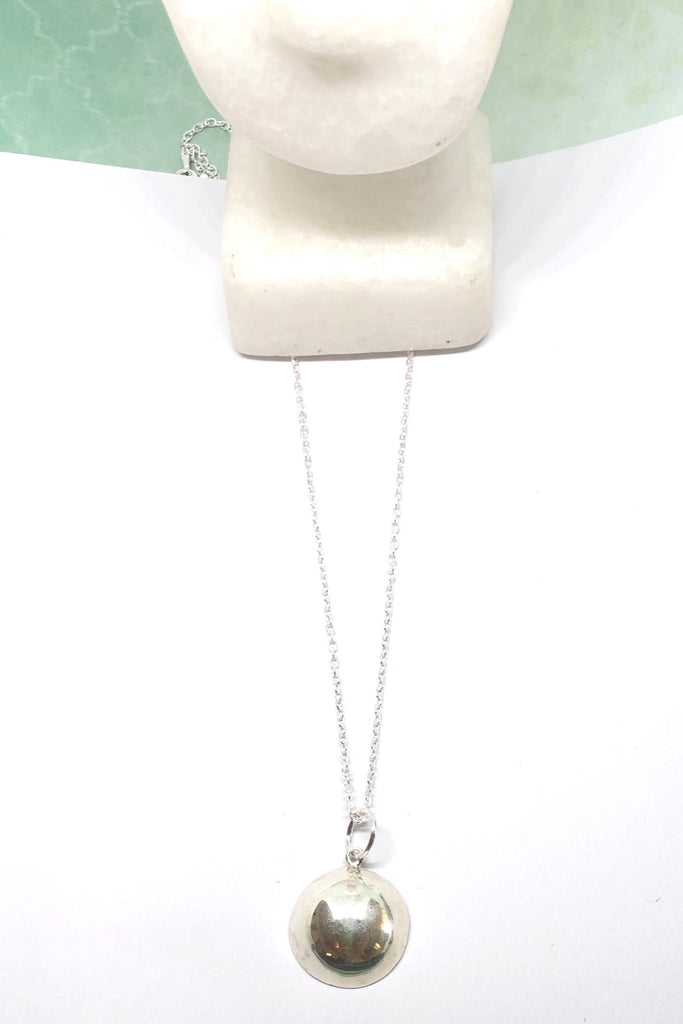 Silver pendant designed in African chic modern style.