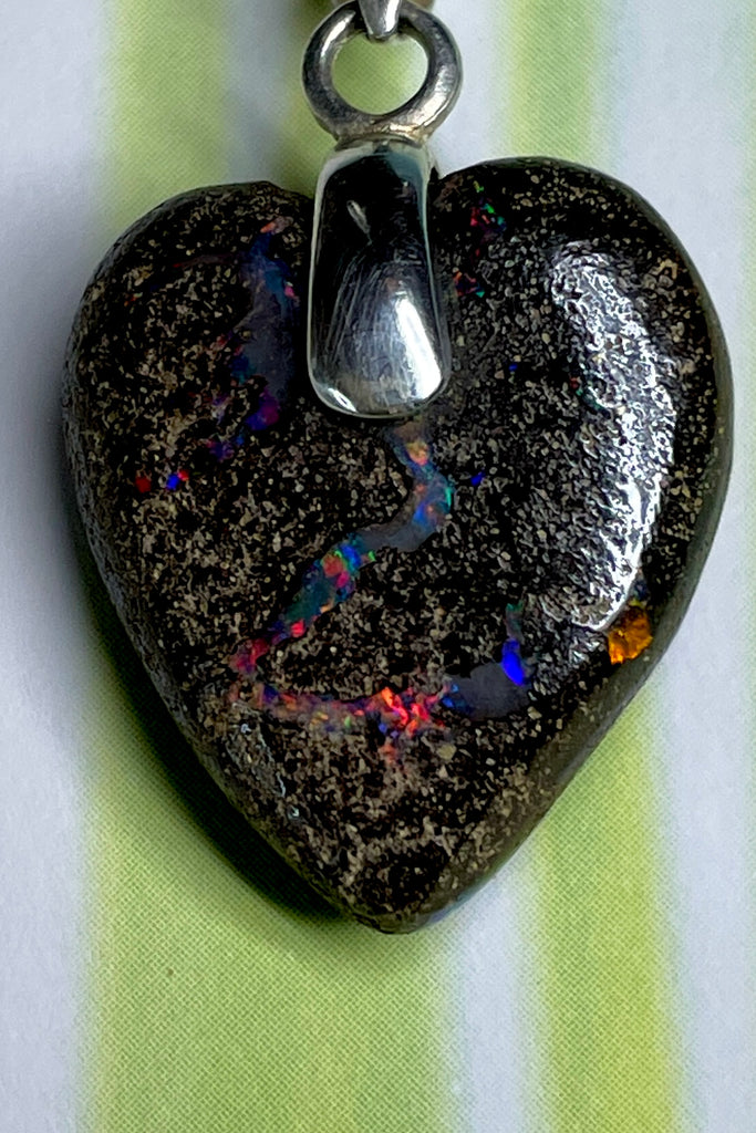 From our range of Australian opal heart pendants.  This intriguing piece of Boulder Opal was mined at Winton, then cut and polished for Mombasa Rose in Noosa, Queensland