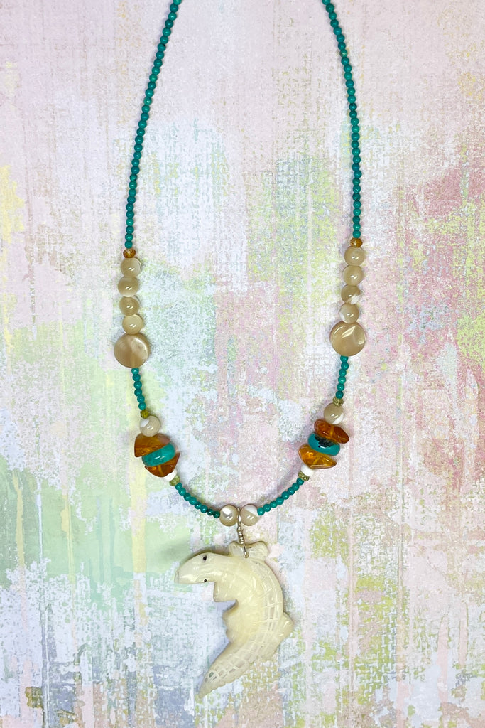 This necklace is a one off piece, the stones are all natural semi precious gems and mother of pearl shell. The crocodile is hand carved from a mother of pearl sea shell