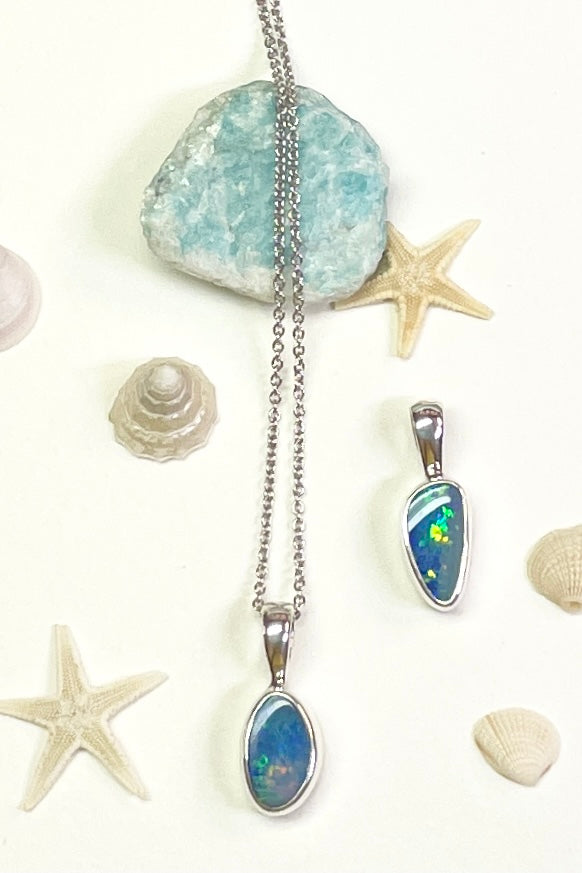 The Australian opal pendant is shaped into a small round oval shape, very dainty.