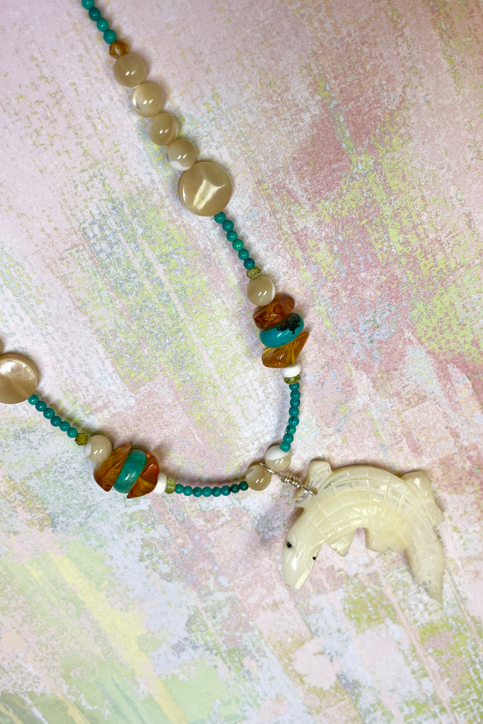 This necklace is a one off piece, the stones are all natural semi precious gems and mother of pearl shell. The crocodile is hand carved from a mother of pearl sea shell