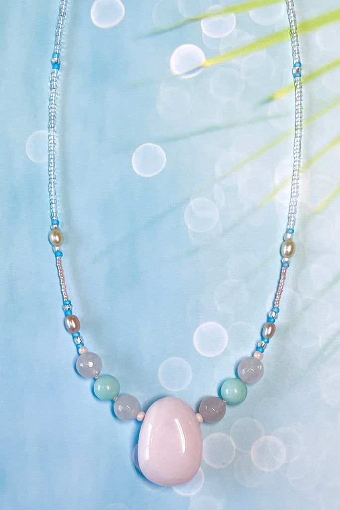 a pretty necklace with a pink agate centre stone, it is a sweet choker style