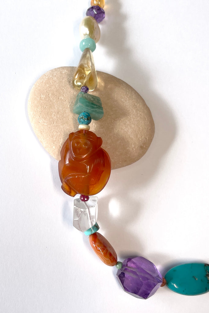 Beads are - Strawberry Quartz, Smokey Quartz, Pearl, Amazonite, Peruvian Agate, Amethyst, Carnelian, Agate, natural Sunstone, Ametrine, clear Rock Crystal, Green glass from South Africa, Natural genuine Turquoise - the centre turquoise bead is very old.