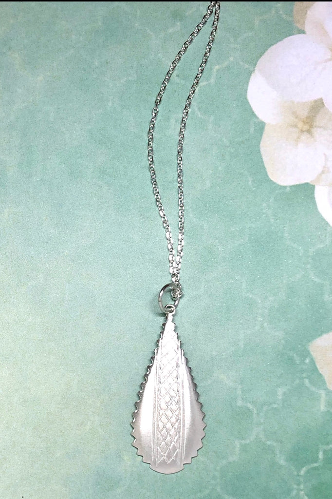 Silver pendant designed in African chic modern style.
