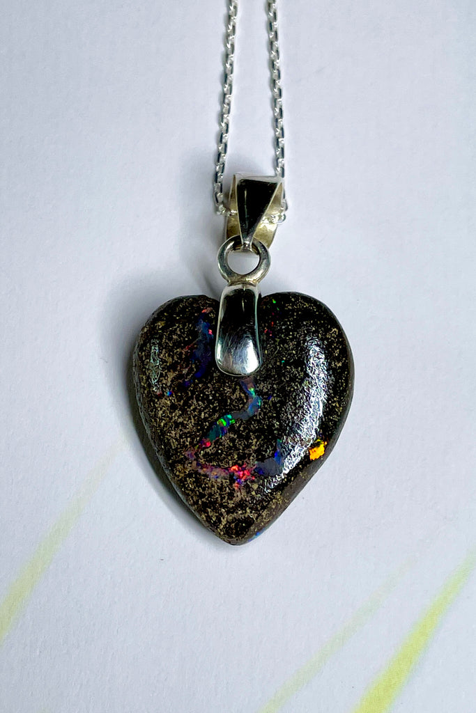 From our range of Australian opal heart pendants.  This intriguing piece of Boulder Opal was mined at Winton, then cut and polished for Mombasa Rose in Noosa, Queensland