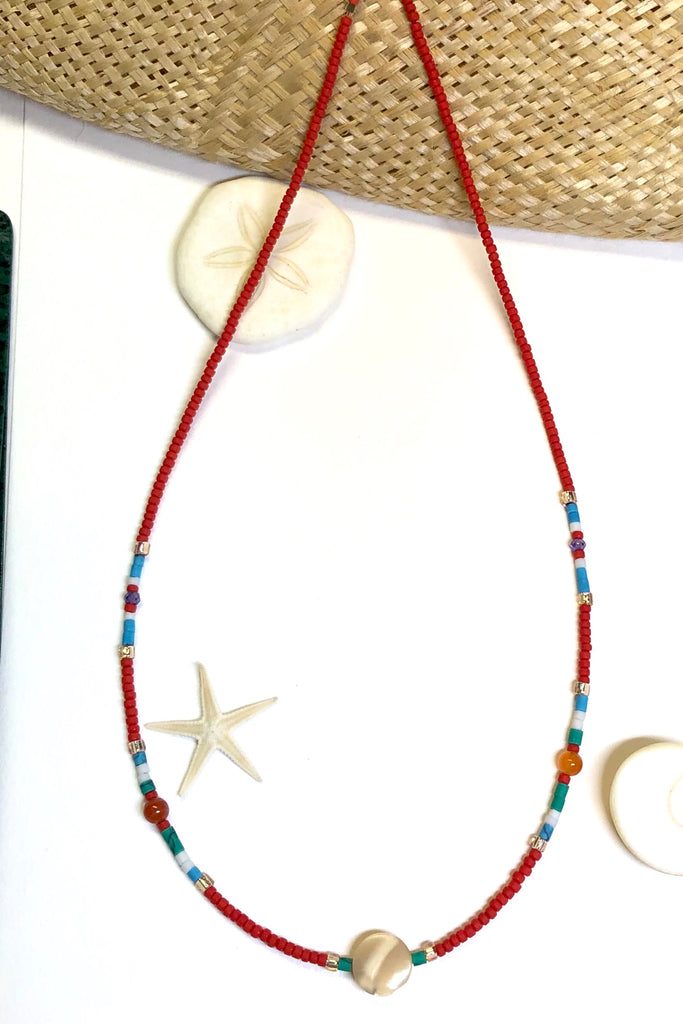 Necklace Cay Island Green is exclusive and handmade featuring 45cm in length and tiny Afghan seed beads, Mother of Pearl, glass and carnelian stone.