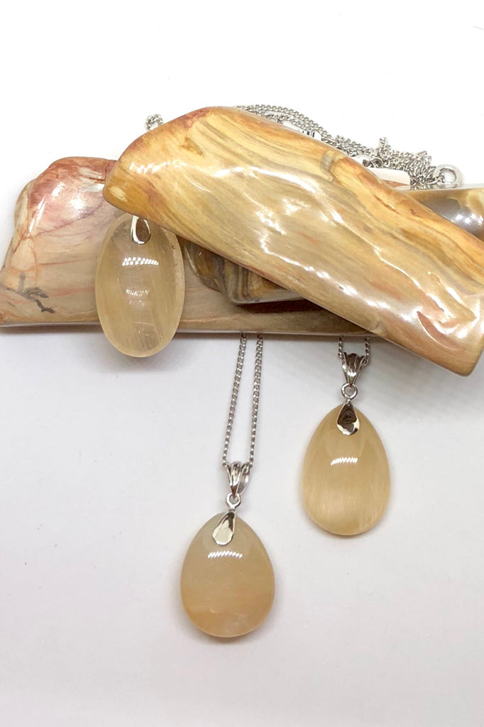The Pendant of Golden Rutilated Quartz on a Silver Chain 1  will bring through intense energy featuring 3.5 cm length and coming on a silver chain.
