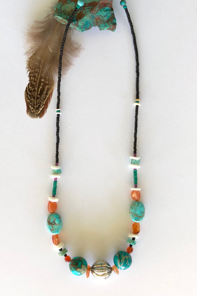 Necklace Cay Silver Ball has gorgeous beads including Carnelian, turquoise coloured howlite stone, shell and Turkish glass beads and hill tribe silver centre piece in the shape of a ball with stamping detail.