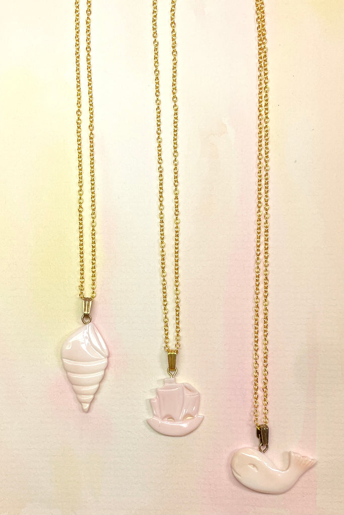 Rare pink conch shell hand carved into an island style. Comes on a gold vermeil chain