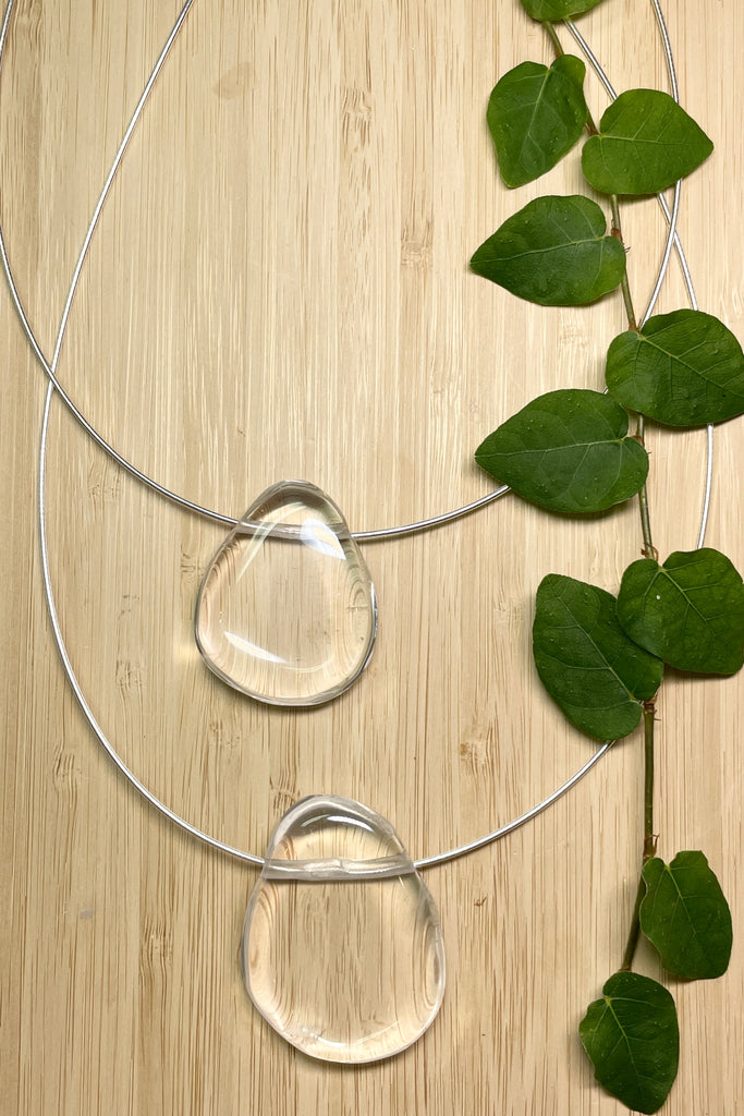 The Pendant is a gorgeous clear rock crystal, it hangs from a 925 silver Omega chain.