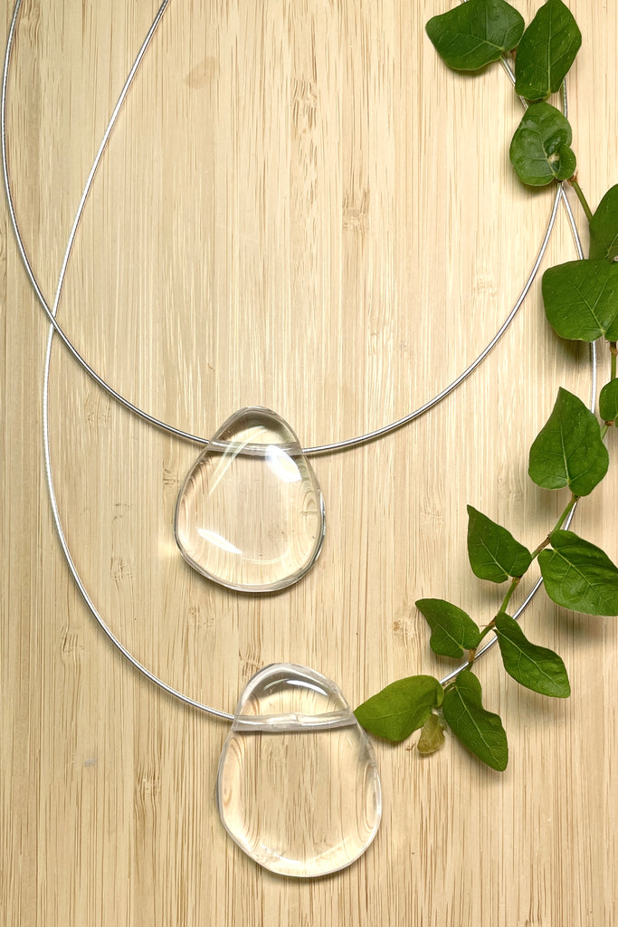 The Pendant is a gorgeous clear rock crystal, it hangs from a 925 silver Omega chain.