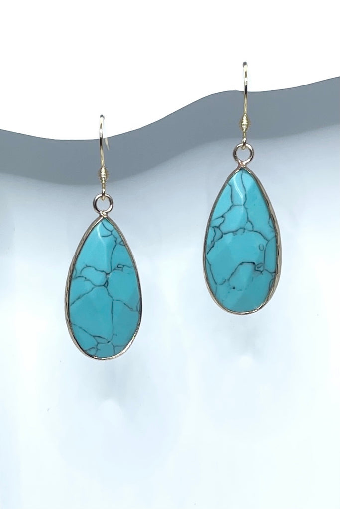 These earrings in Turquoise simulant are bezel set in gold tone, a perfect summer boho style.