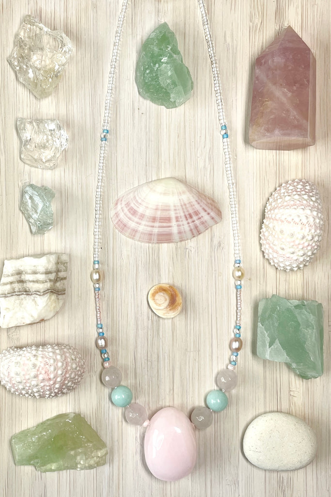 a pretty necklace with a pink agate centre stone, it is a sweet choker style