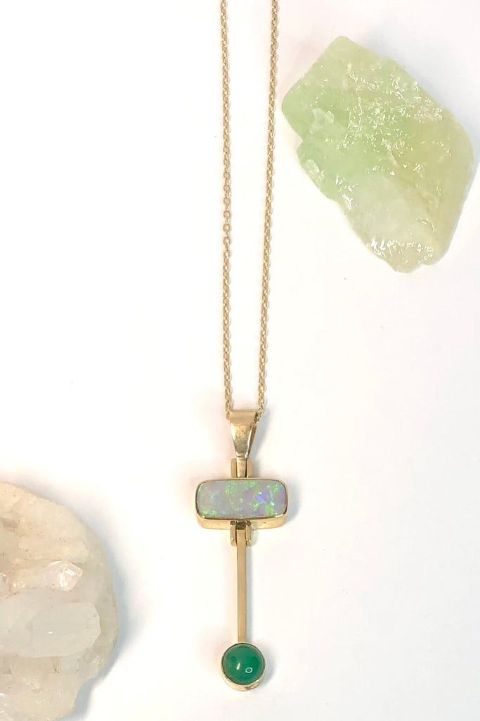 This really cool Vintage pendant features a stunning solid Australian Opal with hanging bar which has a deep green Queensland Chrysoprase cabochon detail.