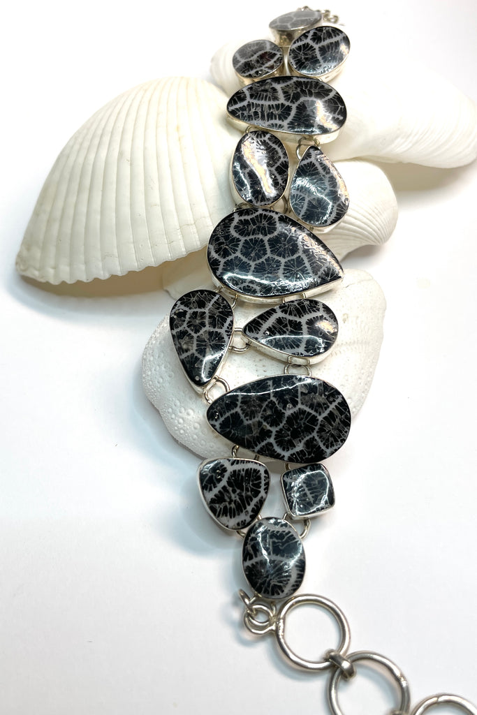 lovely Smokey silver grey mother of pearl bracelet, each shape has been individually set and rim set into heavy 925 silver. A very pretty and well made bracelet.