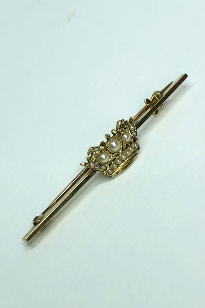 A Royal Navy & Merchant Services gold and pearl nautical crown sweetheart brooch, with 14 pearls set in 18 Carat gold,