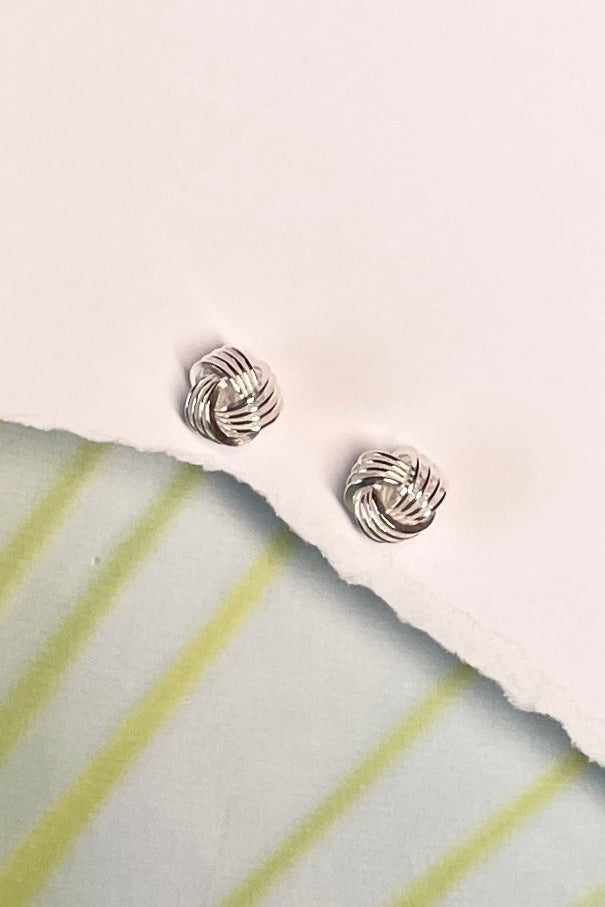 Silver stud earrings formed as a tiny rope knot in 925 Silver, a perfect lightweight everyday earring with a hint of sophistication