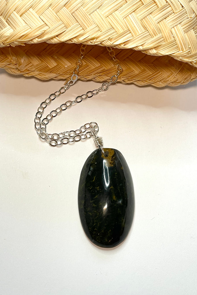 This pendant is a lovely piece of dark grey green Agate stone that has been skillfully cut into a pleasing oval shape then polished, by ROAM Ladies Lapidary Collective in Sakaraha, Madagascar. 