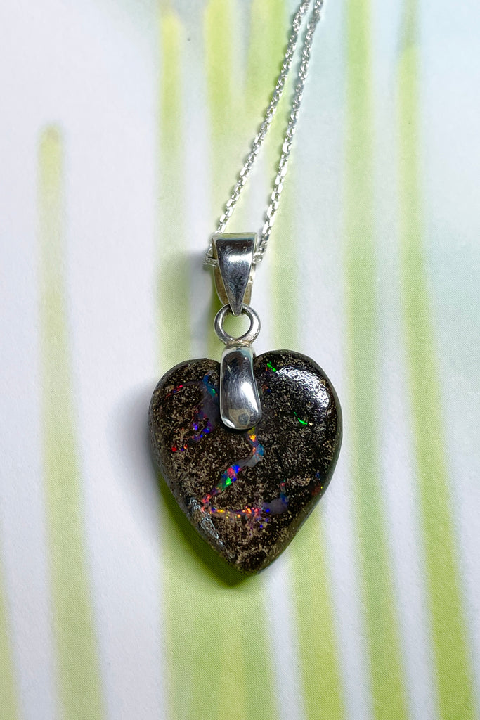 From our range of Australian opal heart pendants.  This intriguing piece of Boulder Opal was mined at Winton, then cut and polished for Mombasa Rose in Noosa, Queensland