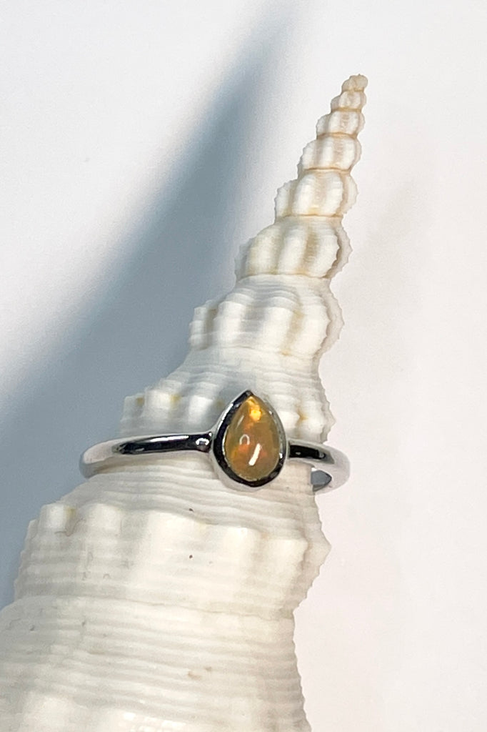 A pretty and luminescent opal gemstone, this darling and dainty little ring is simply perfection, the opal is from Ethopia in Africa, the flashes of colour are so pretty.