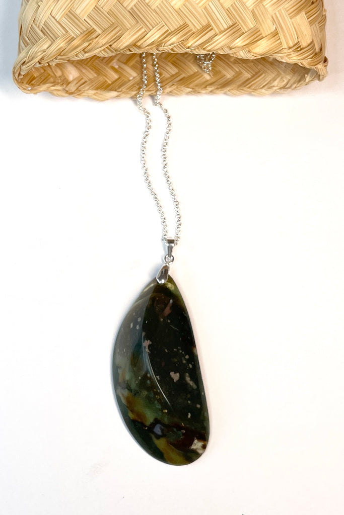 This pendant is a lovely piece of deep grey green Agate stone that has been skillfully cut into a pleasing swirl shape then polished, by ROAM Ladies Lapidary Collective in Sakaraha, Madagascar.