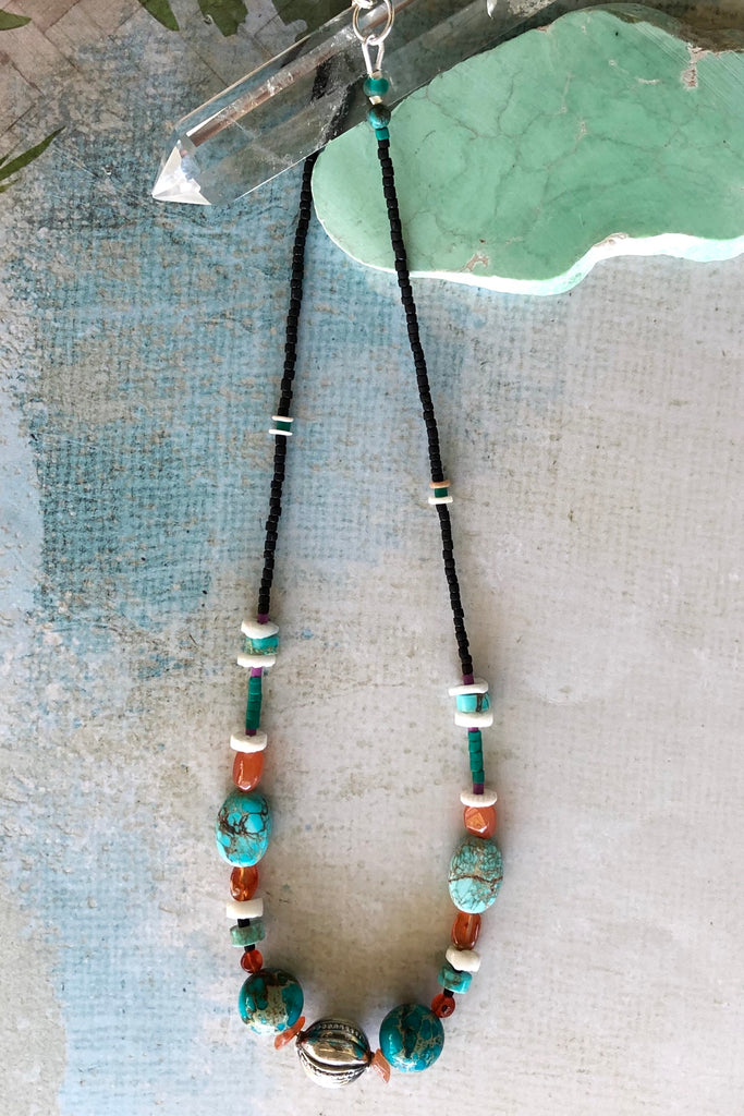 Necklace Cay Silver Ball has gorgeous beads including Carnelian, turquoise coloured howlite stone, shell and Turkish glass beads and hill tribe silver centre piece in the shape of a ball with stamping detail.