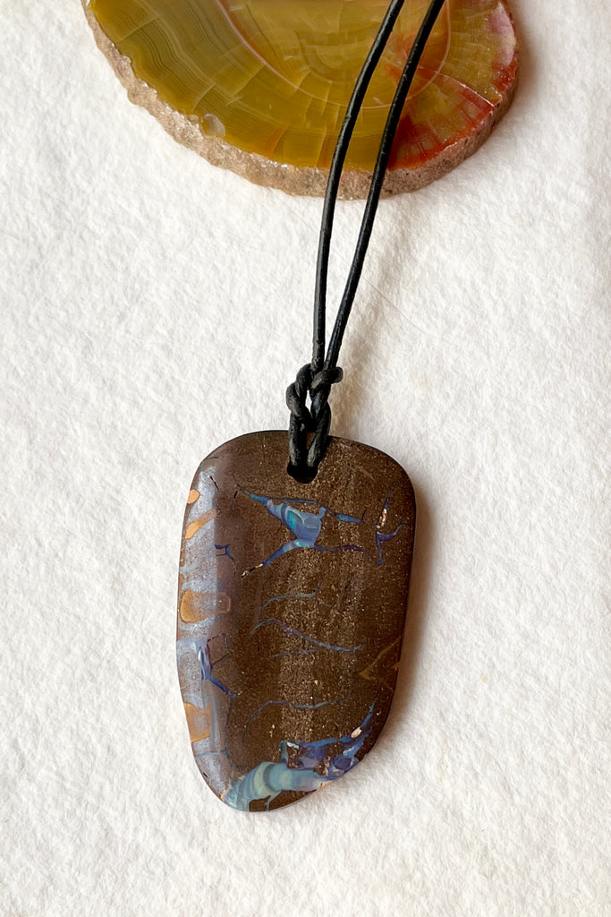 The opal pendant is cut as a freeform rectangle, the colours and rock formations of the material from which it was cut are so beautiful, a secret to the past of the country Australia.  