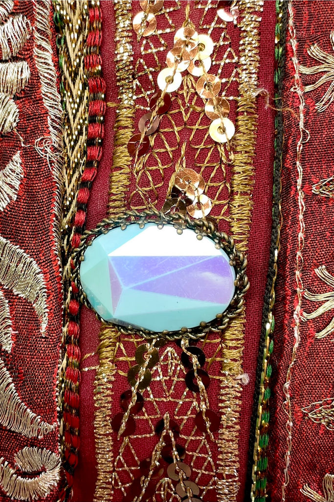 An old and unusual brooch, most likely from the 1930's. The blue is a coated glass the edge is metal