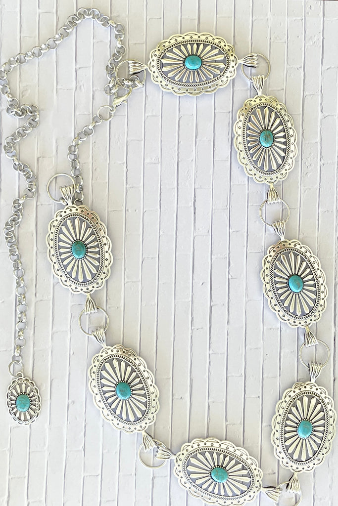 Santa Fe style Conch belt with Turquoise is sure to be one for the bohemian cowgirl