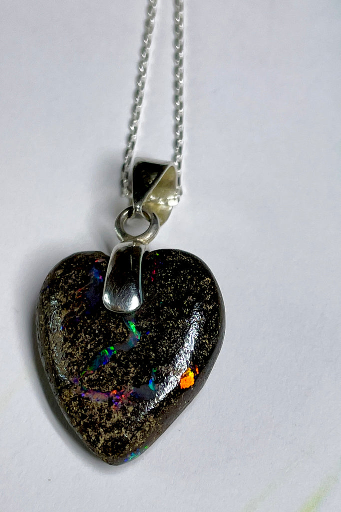 From our range of Australian opal heart pendants.  This intriguing piece of Boulder Opal was mined at Winton, then cut and polished for Mombasa Rose in Noosa, Queensland