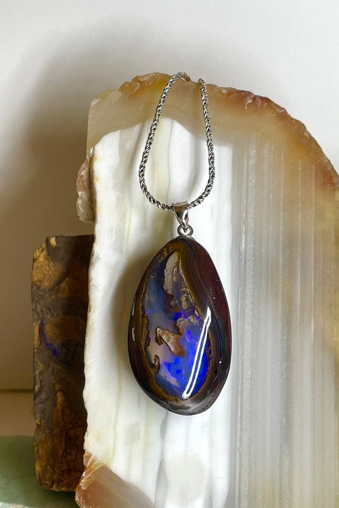 This is a really special piece of Australian Boulder Opal, it has a clear crystal window allowing you to see right into, and through the  piece.