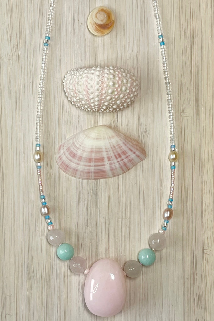 a pretty necklace with a pink agate centre stone, it is a sweet choker style