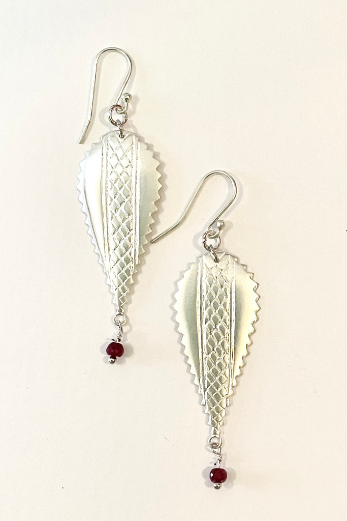 earrings In 925 silver with a small ruby bead suspended from the base. 