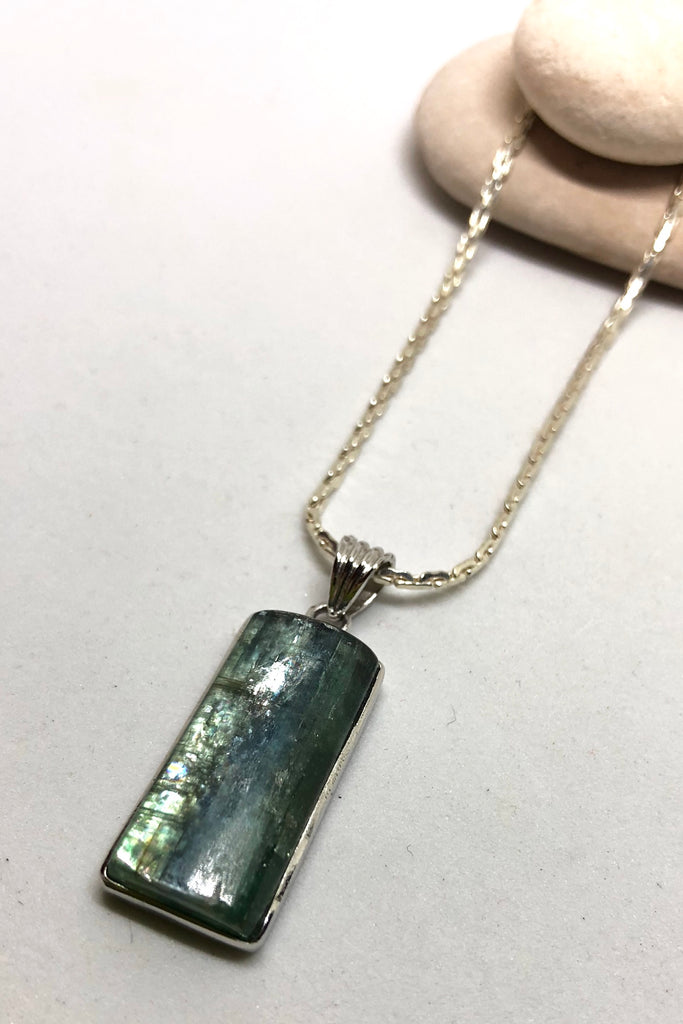 The Pendant of Kyanite on a Silver Chain 3 is a purity of a lovey natural crystal pendant polished to a high shine, 3cm length and 1cm width.