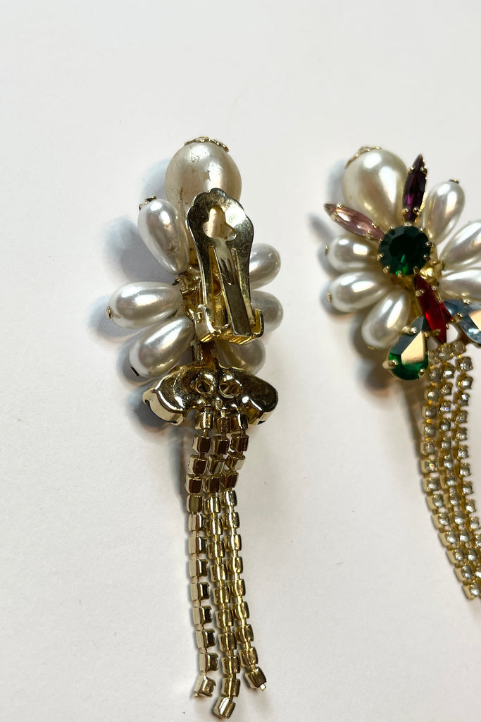 Fun clip on retro earrings featuring bright diamantes and faux pearls with diamante tassels