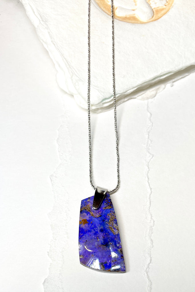 This is a one off piece, a hand cut opal, it shows the mark of the artist who cut and polished the stone. This genuine Australian Opal pendant stone was cut and polished in Australia. 