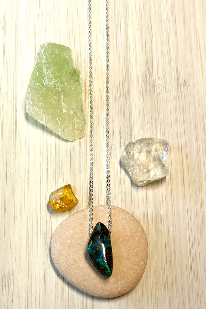 This tiny pendant is made by fusing a fine flash slice of Australian crystal opal into natural boulder stone.