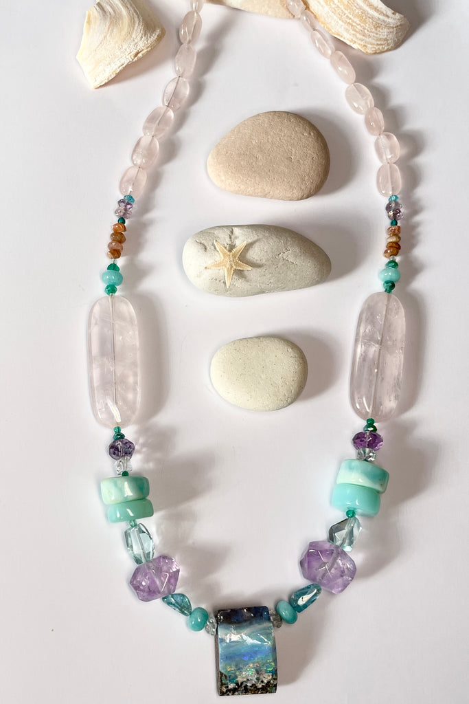 This necklace is one of the first pieces showcasing the opal cutting and jewellery designs from North Shore Opals Australia.  The centrepiece is cut from an opal "split" so the surface is not polished but left exactly as it has been for millions of years.