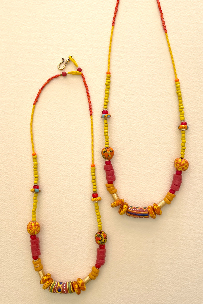 necklace is from our exclusive range of jewellery highlighting the beautiful African recycled powder glass beads made by the people of Krobo Mountain in Ghana