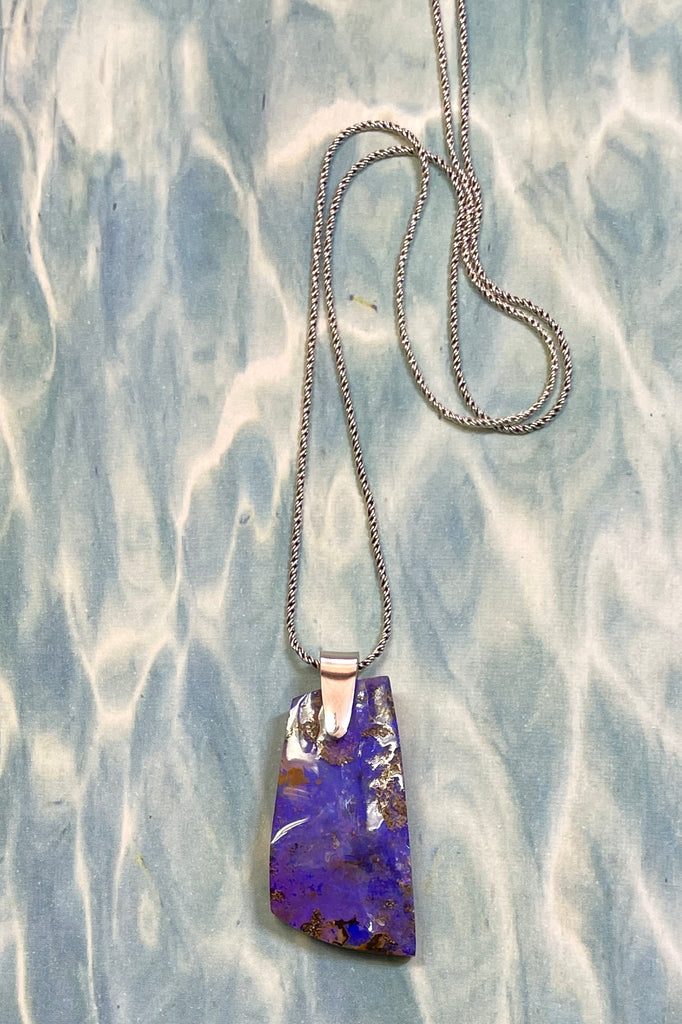 This is a one off piece, a hand cut opal, it shows the mark of the artist who cut and polished the stone. This genuine Australian Opal pendant stone was cut and polished in Australia. 