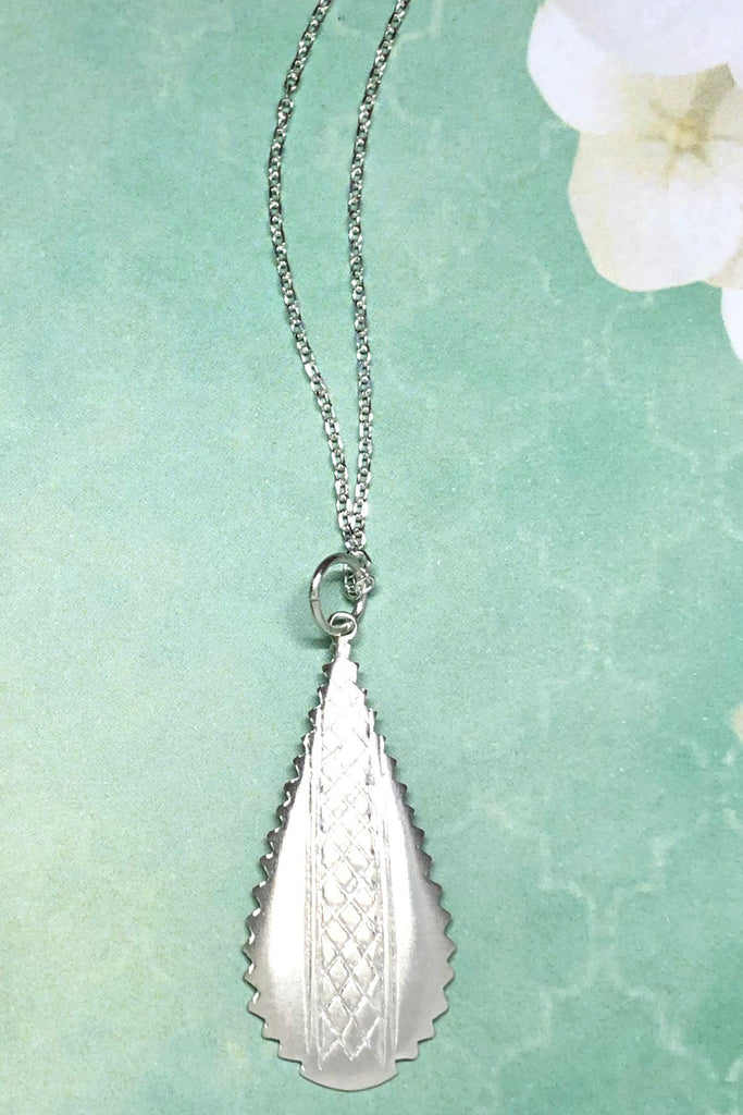 Silver pendant designed in African chic modern style.