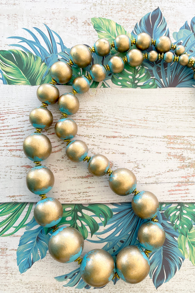  A Long necklace with hand painted beads in graduating sizes