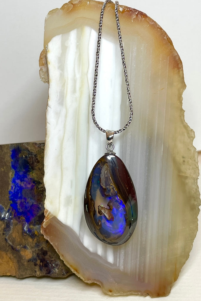 This is a really special piece of Australian Boulder Opal, it has a clear crystal window allowing you to see right into, and through the  piece.