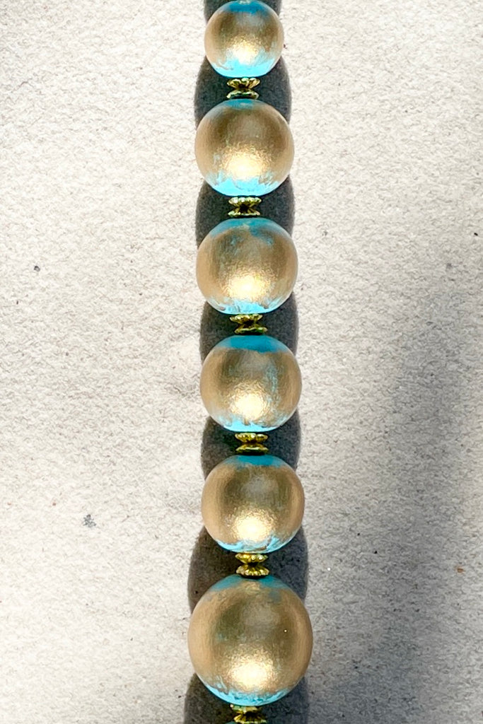  A Long necklace with hand painted beads in graduating sizes