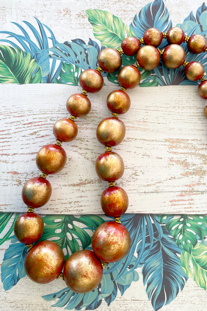  A Long necklace with hand painted beads in graduating sizes
